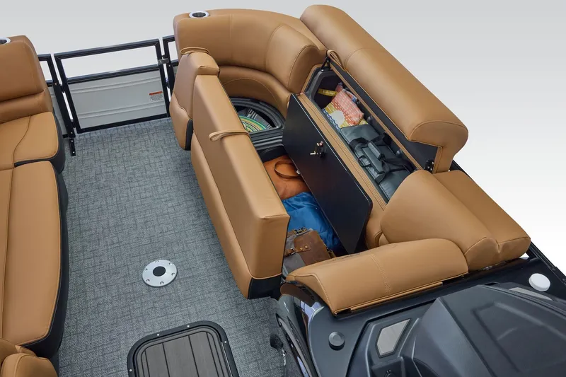 Slide: The Image of 2026 Regency 230 DL boat interior with tan seating and storage compartment open. - 14