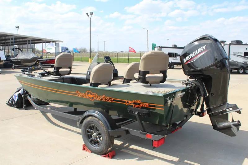 Slide: The Image of 2026 Tracker Bass Tracker Classic Limited boat with Mercury engine on trailer. - 46
