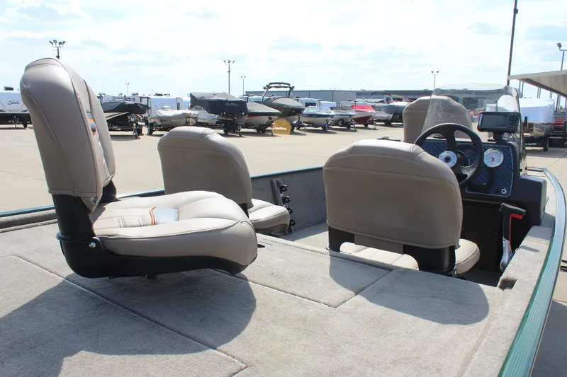 Slide: The Image of 2026 Tracker Bass Tracker Classic Limited boat interior with seating and dashboard view. - 47