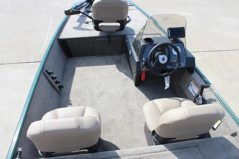 Slide: The Image of 2026 Tracker Bass Tracker Classic Limited boat interior with steering console and seating. - 48