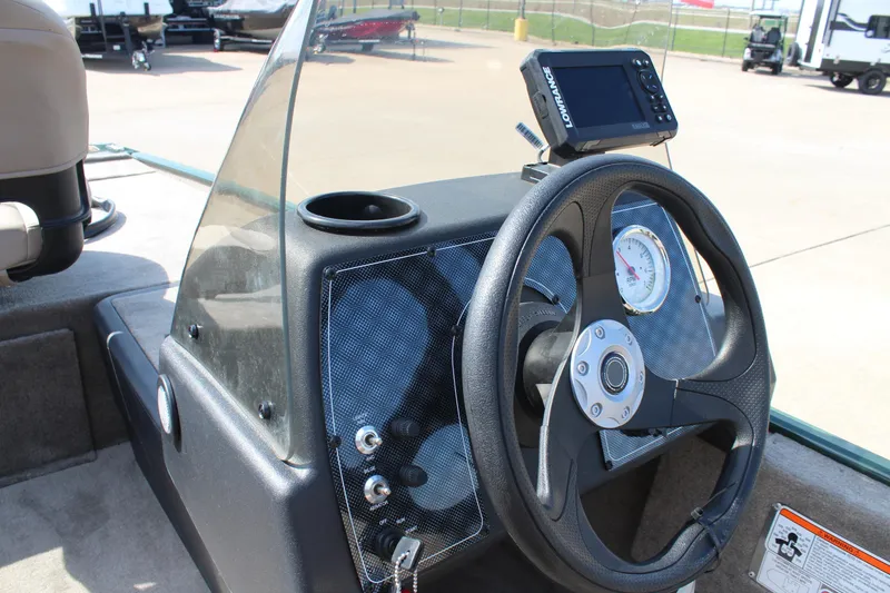 Slide: The Image of Steering console of 2026 Tracker Bass Tracker Classic Limited boat with navigation display. - 49