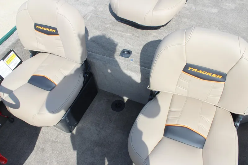 Slide: The Image of 2026 Tracker Bass Tracker Classic Limited boat seats with beige upholstery and logo detailing. - 55