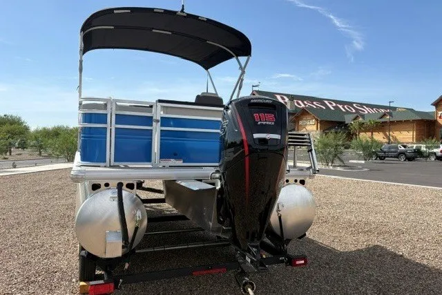 Slide: The Image of 2026 Sun Tracker Fishin' Barge 20 DLX pontoon boat with Mercury 115 outboard motor. - 2