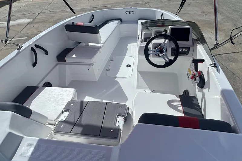 Slide: The Image of 2026 Tahoe T16 boat interior with modern steering and seating arrangement. - 1