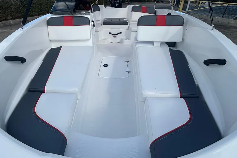 Slide: The Image of 2026 Tahoe T16 boat interior with white and gray seating, red accents. - 2