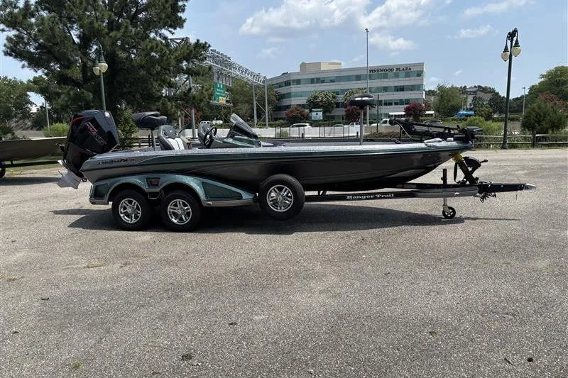 Slide: The Image of 2026 Ranger Z520R Cup-Equipped boat on trailer in parking lot, sunny day. - 7