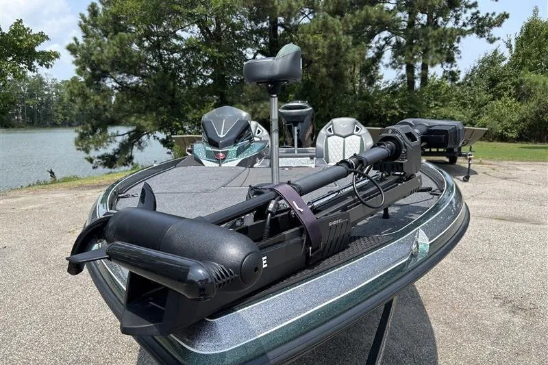 Slide: The Image of 2026 Ranger Z520R Cup-Equipped boat with advanced trolling motor, parked by a scenic lake. - 2