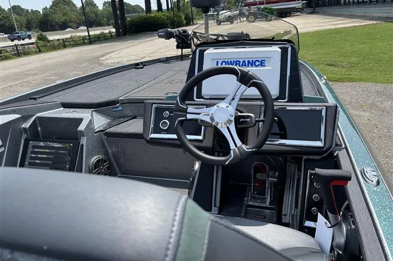 Slide: The Image of 2026 Ranger Z520R Cup-Equipped boat interior with steering wheel and Lowrance display. - 9