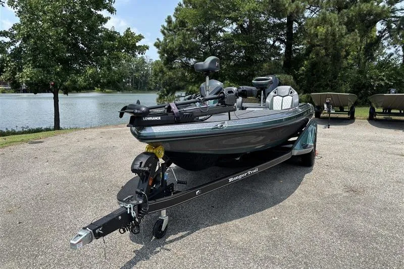 Slide: The Image of 2026 Ranger Z520R Cup-Equipped boat on trailer by a lake, ready for fishing. - 1