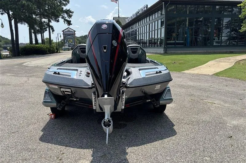 Slide: The Image of 2026 Ranger Z520R Cup-Equipped boat, rear view, parked outdoors near a building. - 3