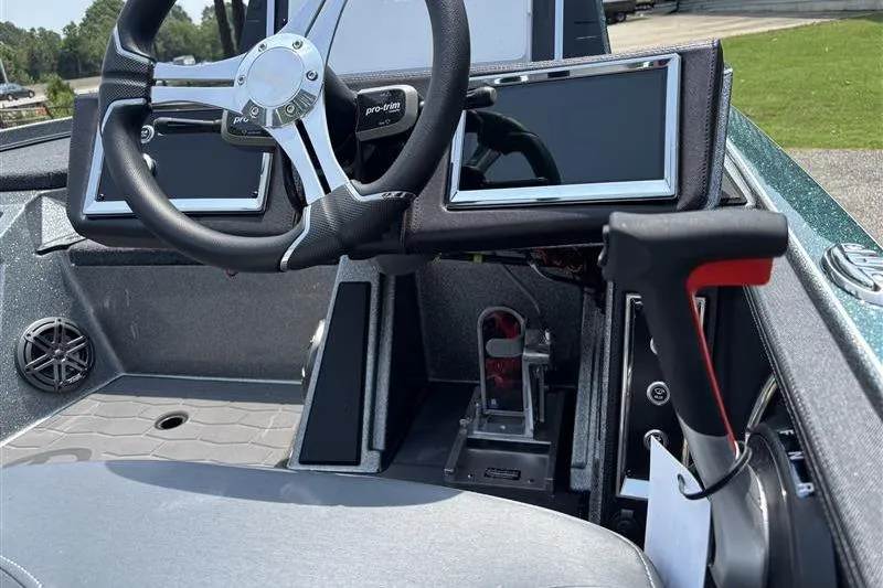 Slide: The Image of 2026 Ranger Z520R Cup-Equipped boat dashboard with steering wheel and digital displays. - 10