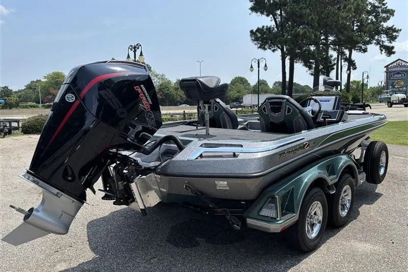 Slide: The Image of 2026 Ranger Z520R Cup-Equipped boat with powerful outboard motor, parked outdoors. - 5