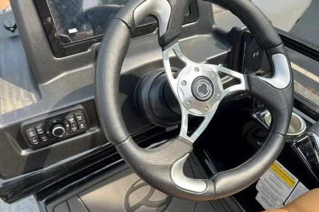 Slide: The Image of Steering wheel of 2026 Regency 250 DL boat with control panel. - 83