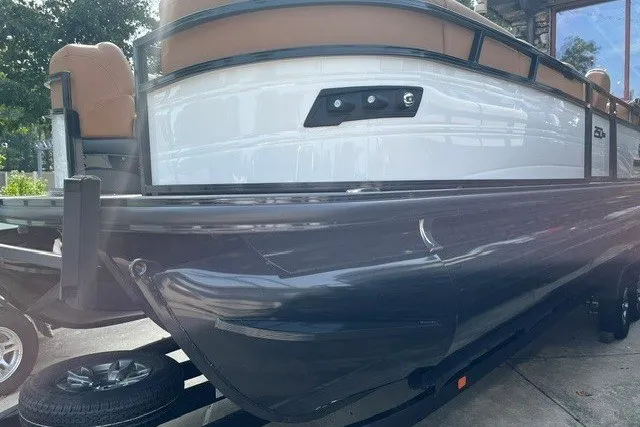 Slide: The Image of 2026 Regency 250 DL boat on trailer, featuring sleek design and modern seating. - 4