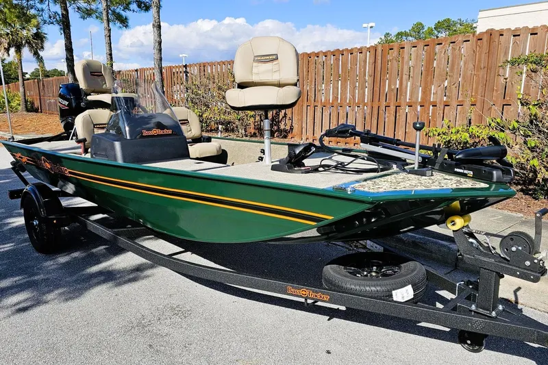 Slide: The Image of 2026 Tracker Bass Tracker Classic Limited boat on trailer, parked outdoors. - 2