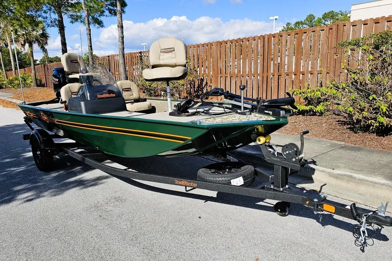 Slide: The Image of 2026 Tracker Bass Tracker Classic Limited boat on trailer, parked outdoors. - 3