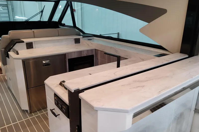 Slide: The Image of Interior of 2026 Formula 500 Super Sport Crossover with modern kitchen design. - 11