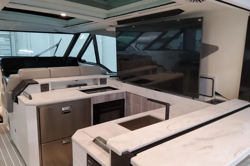 Slide: The Image of Luxurious interior of 2026 Formula 500 Super Sport Crossover yacht with modern kitchen amenities. - 12