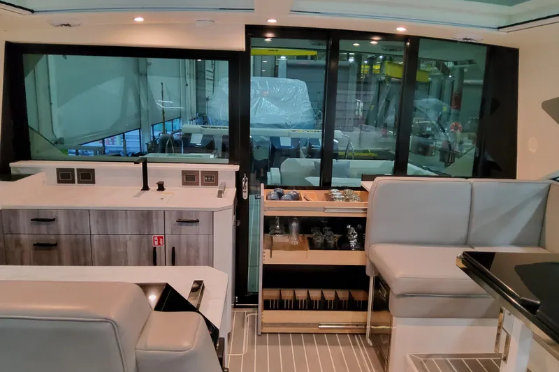 Slide: The Image of Luxurious interior of 2026 Formula 500 Super Sport Crossover yacht with modern kitchen and seating. - 14