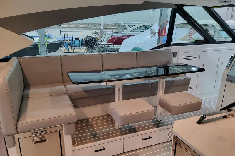 Slide: The Image of Luxurious interior of 2026 Formula 500 Super Sport Crossover yacht with sleek seating and table. - 15