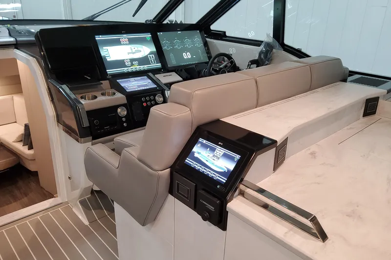 Slide: The Image of Interior of 2026 Formula 500 Super Sport Crossover with advanced navigation displays and luxurious seating. - 16