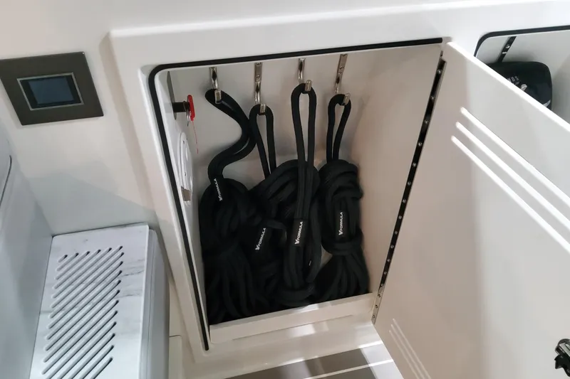 Slide: The Image of Storage compartment with black ropes in a 2026 Formula 500 Super Sport Crossover boat. - 20