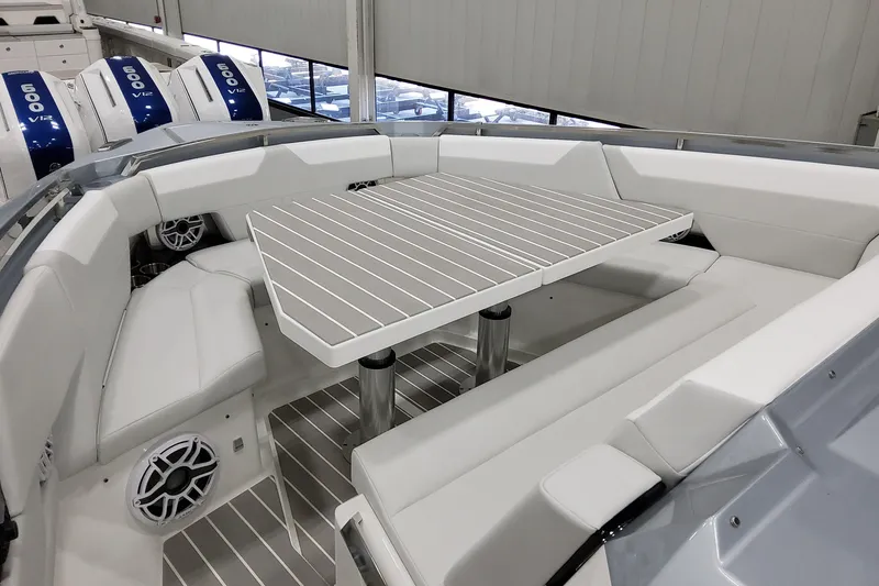 Slide: The Image of 2026 Formula 500 Super Sport Crossover boat interior with sleek seating and table. - 24