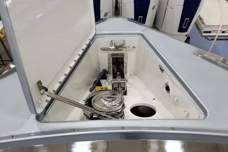 Slide: The Image of Open hatch of 2026 Formula 500 Super Sport Crossover boat, showcasing anchor storage. - 26