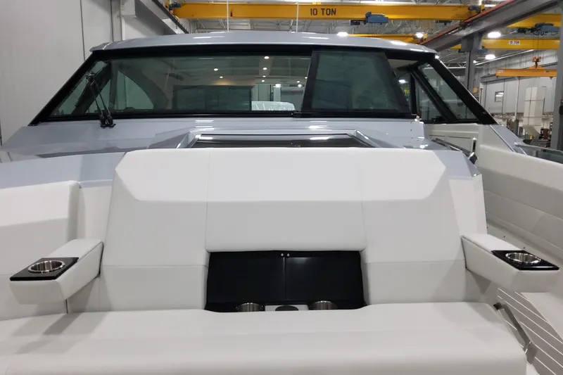 Slide: The Image of 2026 Formula 500 Super Sport Crossover boat interior with white seating and cup holders. - 27