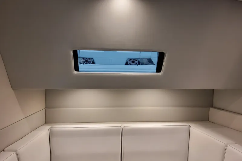 Slide: The Image of Interior of 2026 Formula 500 Super Sport Crossover with sleek seating and window view. - 34