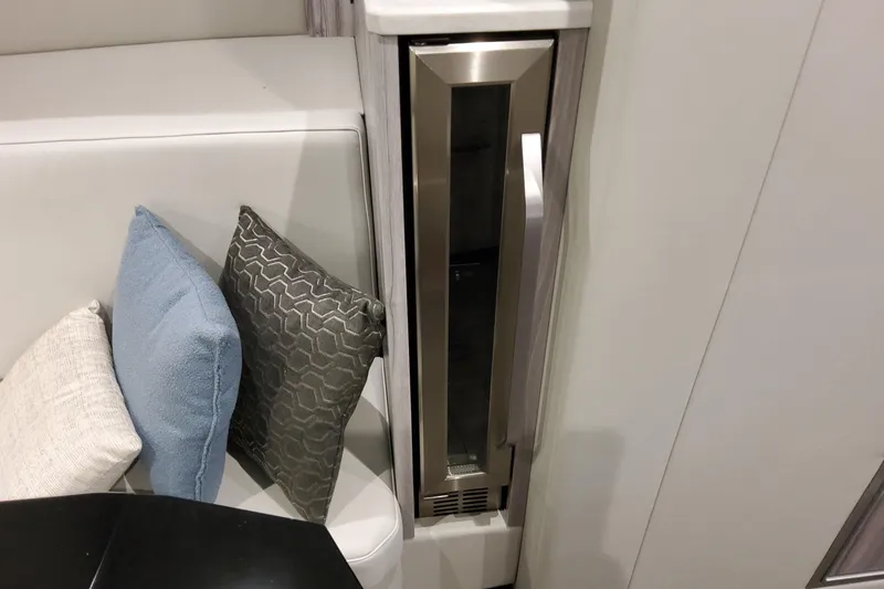 Slide: The Image of Modern interior of 2026 Formula 500 Super Sport Crossover with sleek fridge and cushions. - 37