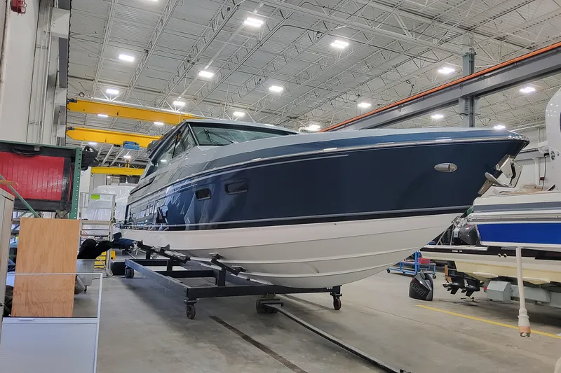 Slide: The Image of 2026 Formula 500 Super Sport Crossover boat in a manufacturing facility. - 4