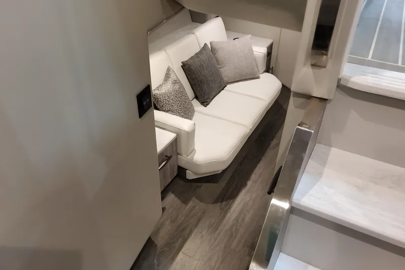 Slide: The Image of Luxurious interior of 2026 Formula 500 Super Sport Crossover with elegant white seating and cushions. - 43