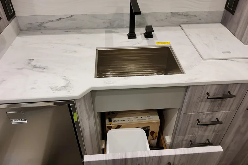 Slide: The Image of Modern kitchen sink area in 2026 Formula 500 Super Sport Crossover with marble countertop. - 47