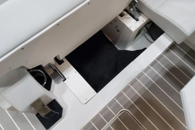Slide: The Image of Interior view of 2026 Formula 500 Super Sport Crossover boat, showcasing seating and storage area. - 48