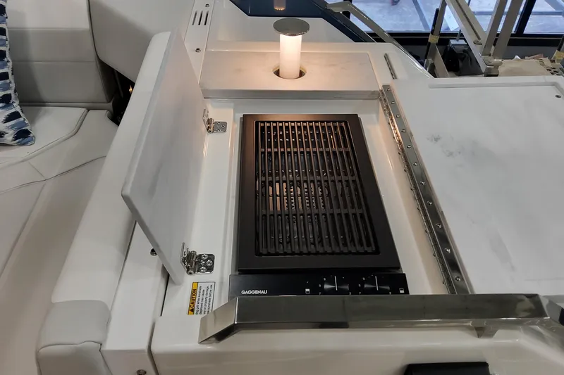 Slide: The Image of Outdoor grill on 2026 Formula 500 Super Sport Crossover boat, featuring sleek design and modern amenities. - 52