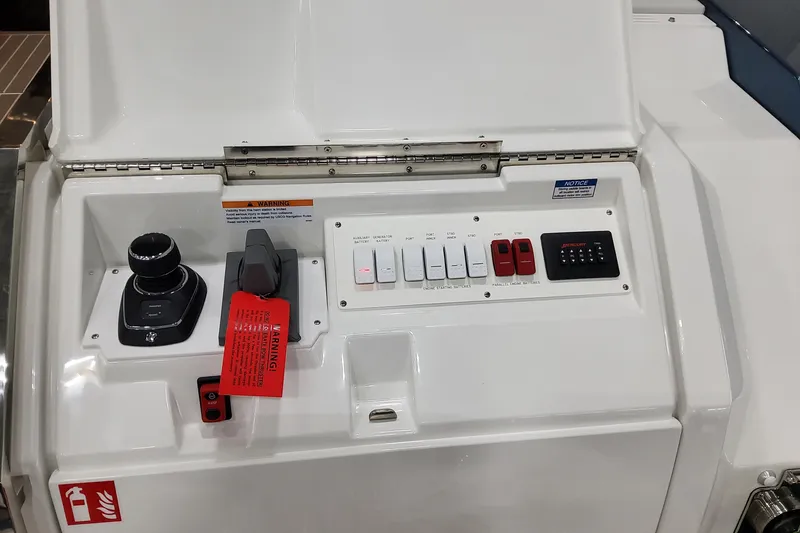 Slide: The Image of Control panel of 2026 Formula 500 Super Sport Crossover boat with joystick and switches. - 58