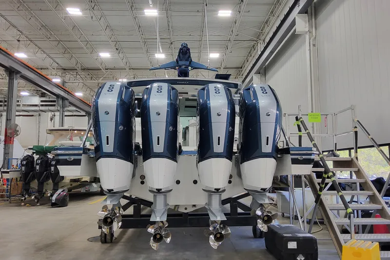 Slide: The Image of 2026 Formula 500 Super Sport Crossover with quad outboard engines in a workshop. - 7