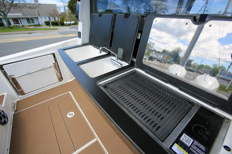 Slide: The Image of Outdoor kitchen setup on 2026 Navan C30 boat with sink and grill. - 11