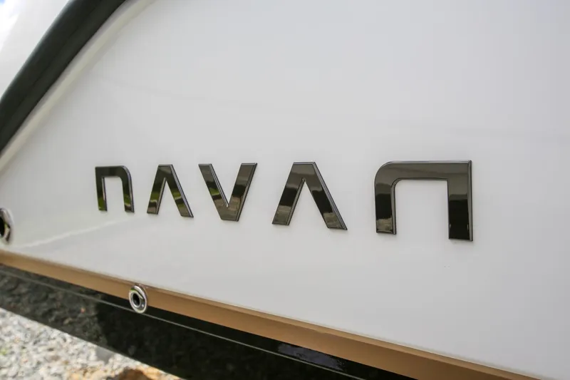 Slide: The Image of Navan C30 2026 logo on white vehicle exterior, close-up view. - 12