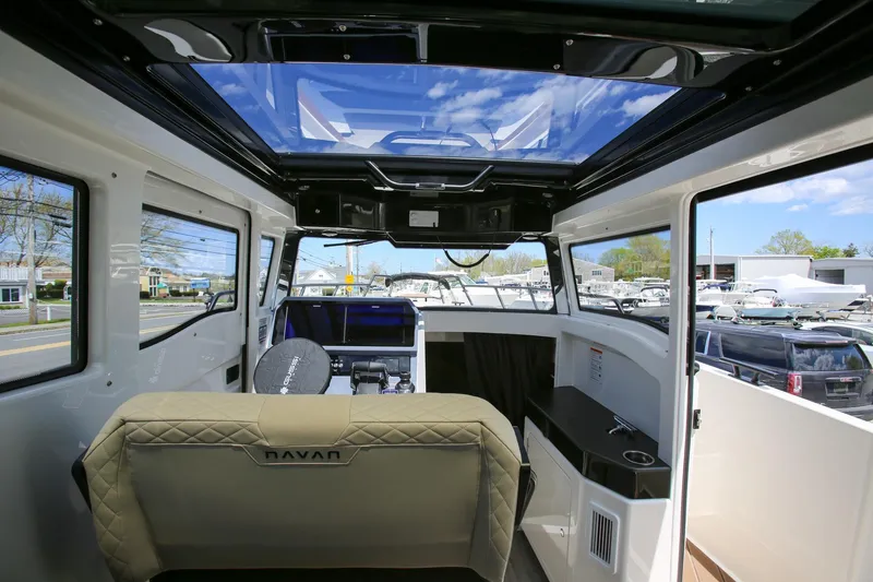 Slide: The Image of Interior view of 2026 Navan C30 boat with panoramic windows and modern seating. - 16