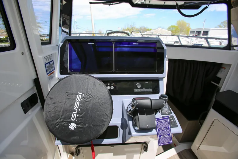 Slide: The Image of Interior cockpit of 2026 Navan C30 boat with advanced navigation controls and Gussi Italia steering. - 18