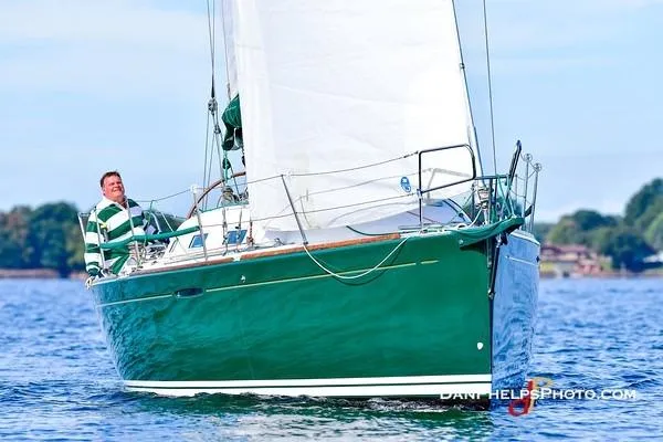 Slide: The Image of Sailing on a 2005 Beneteau First 36.7 yacht with green hull and white sails. - 11