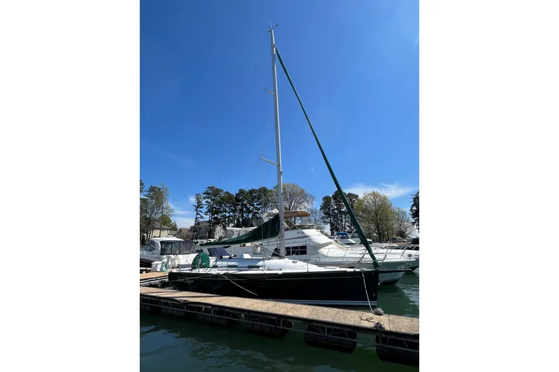 Slide: The Image of Sailboat docked at marina, 2005 Beneteau First 36.7 under clear blue sky. - 15