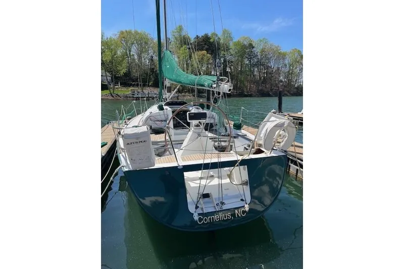 Slide: The Image of 2005 Beneteau First 36.7 sailboat docked, green sail cover, Cornelius, NC. - 17