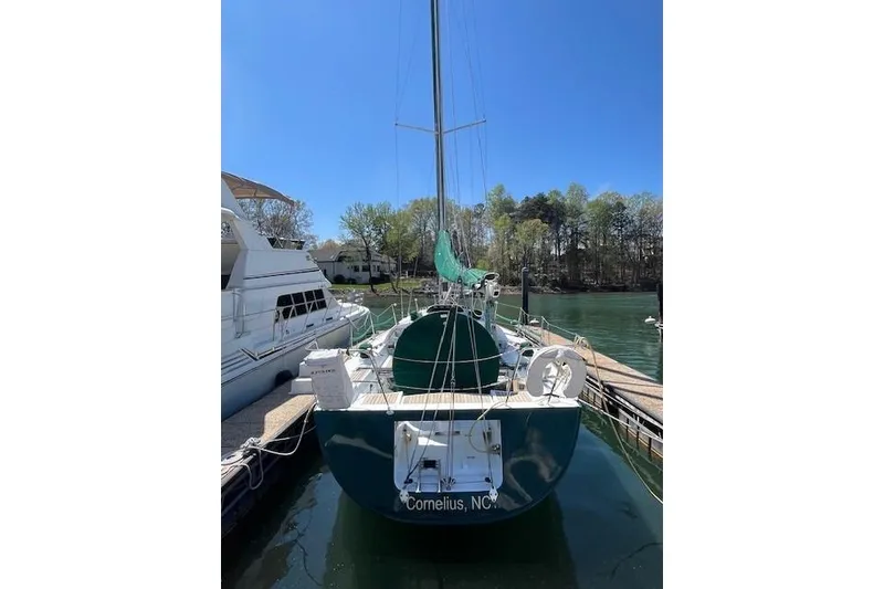 Slide: The Image of 2005 Beneteau First 36.7 sailboat docked in Cornelius, NC, under clear blue sky. - 18