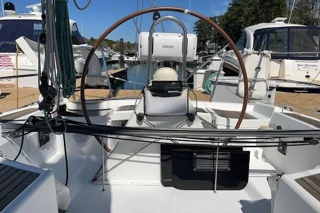 Slide: The Image of Cockpit view of a 2005 Beneteau First 36.7 sailboat docked at a marina. - 20