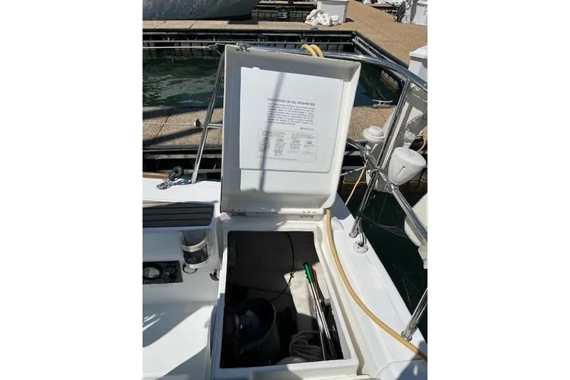 Slide: The Image of Open storage compartment on a 2005 Beneteau First 36.7 sailboat at a marina. - 22