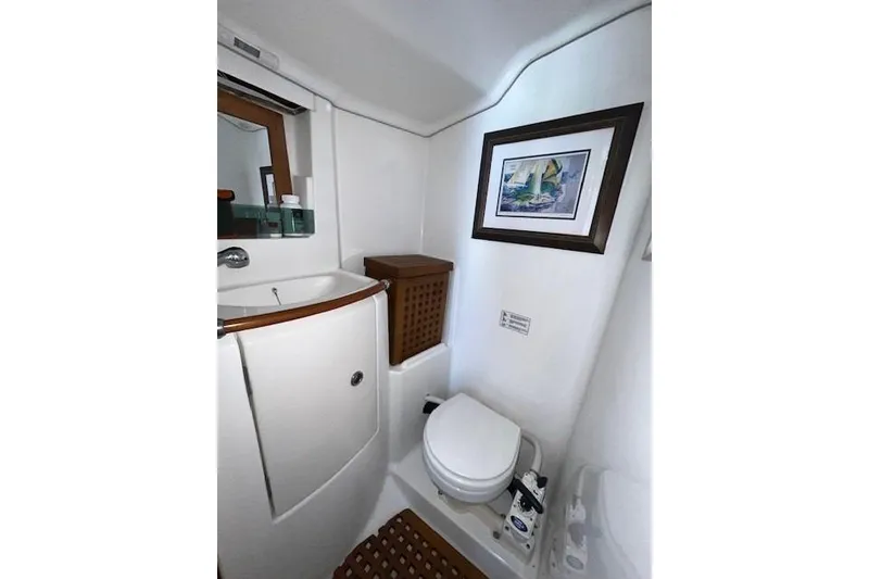 Slide: The Image of Bathroom interior of 2005 Beneteau First 36.7 yacht with framed artwork. - 25
