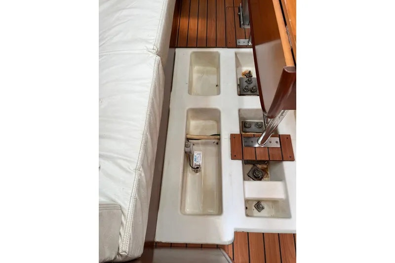 Slide: The Image of Interior view of a 2005 Beneteau First 36.7 sailboat, showcasing seating and storage compartments. - 29